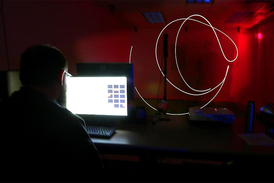 Media arts and game development student works in the studio on the University of Wisconsin Whitewater campus.