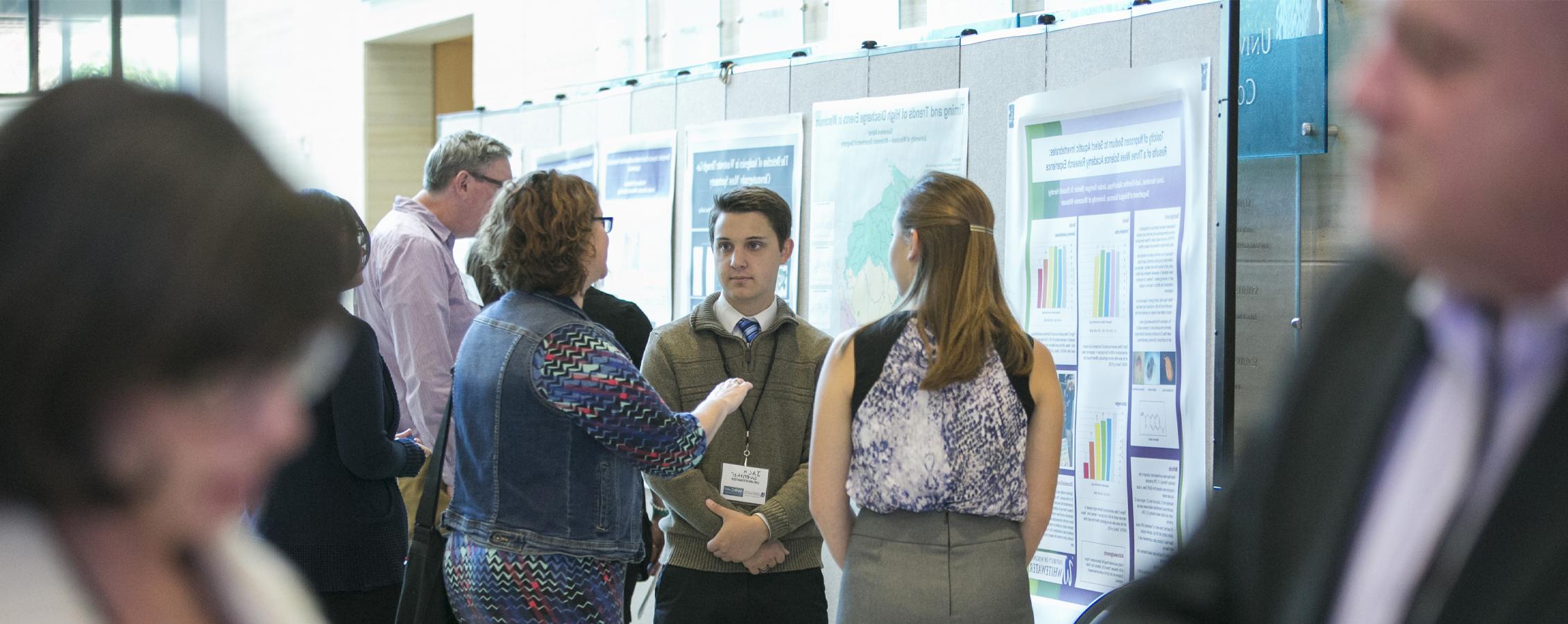 A student presents their research at a water research conference.