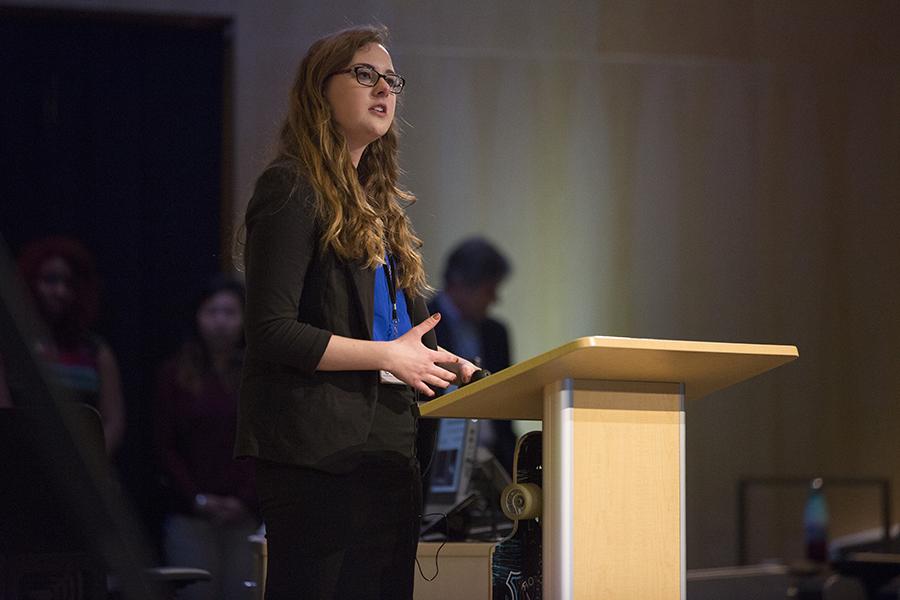 A student speaks at a podium.