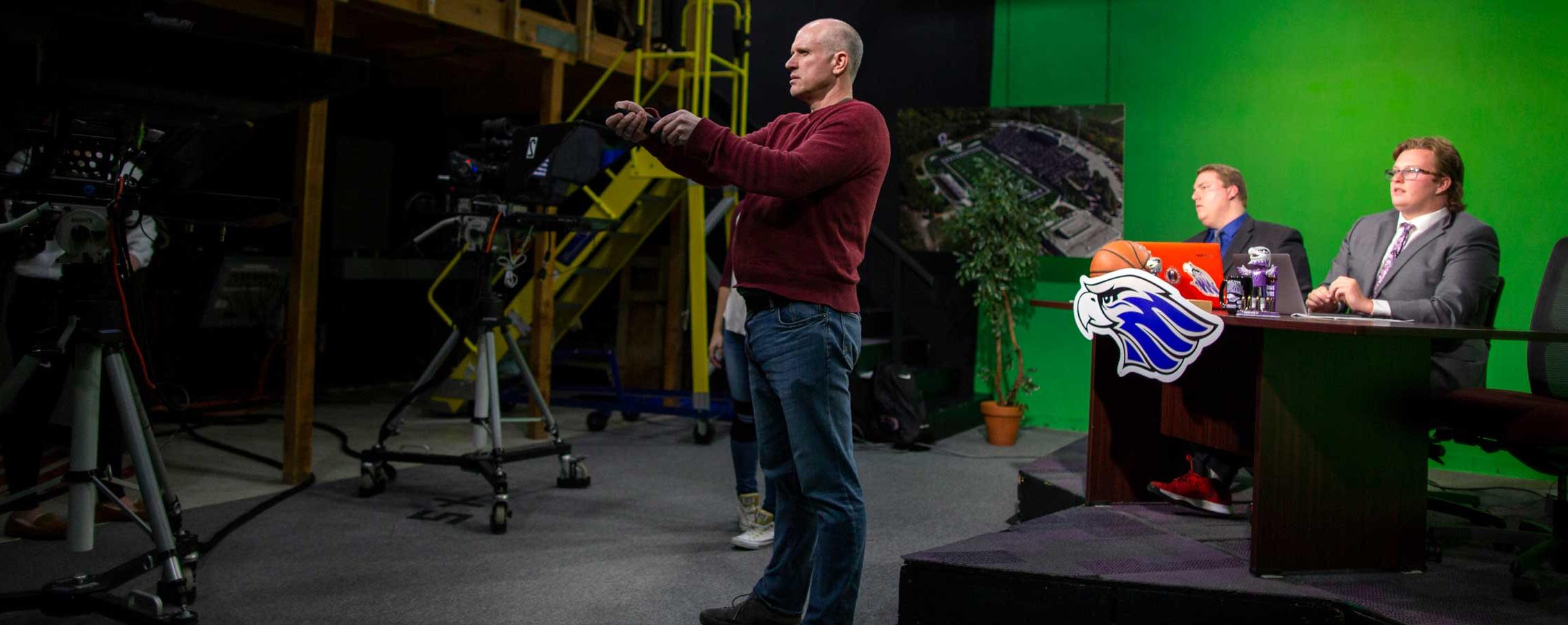 Jim Mead stands in the television studio.