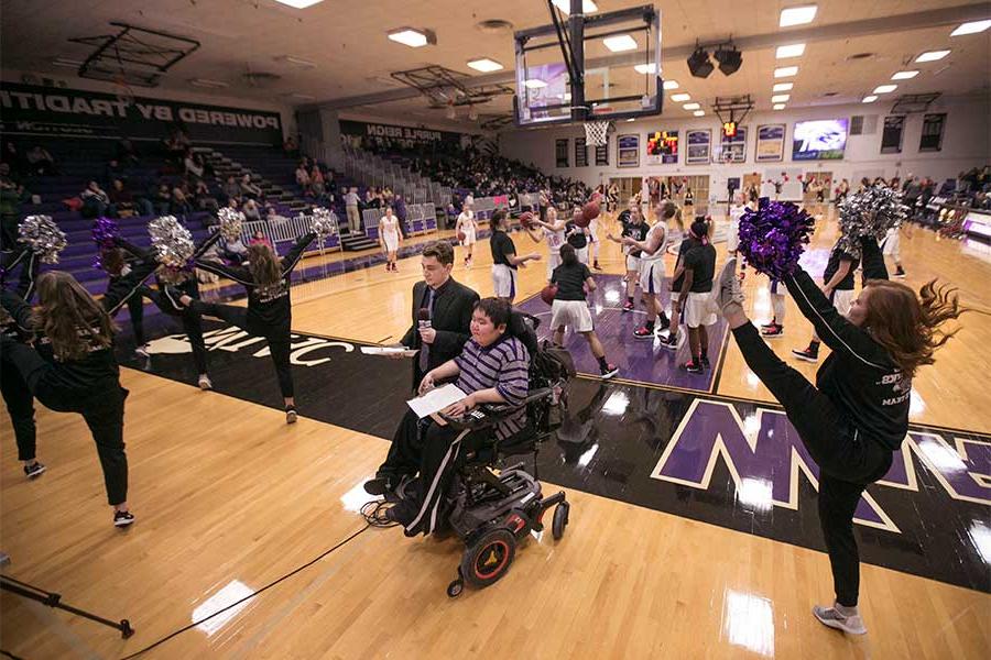 UWW-TV broadcasters on a basketball court.