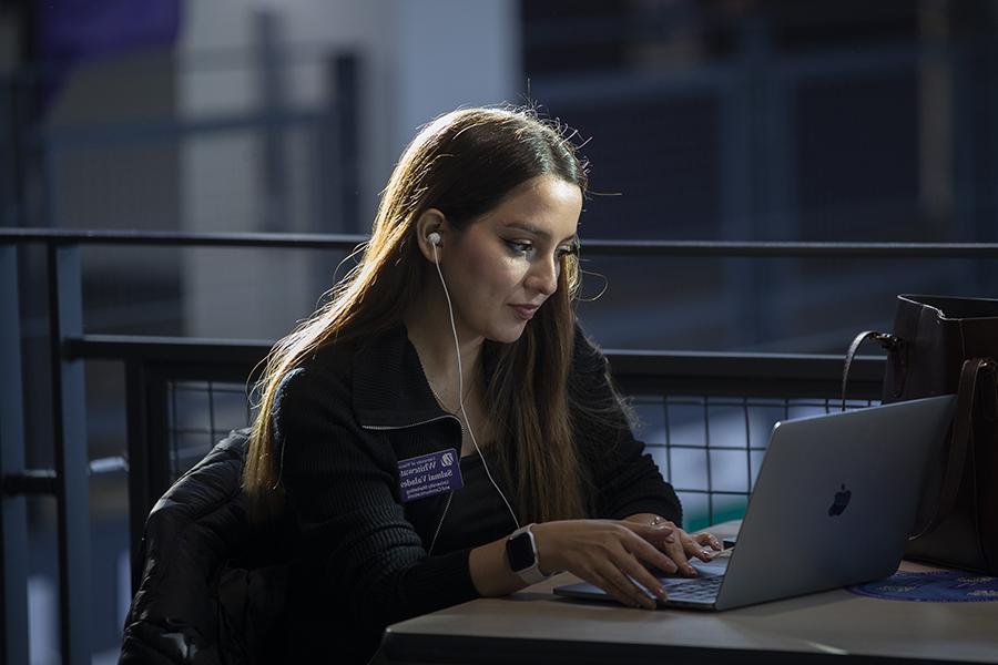 A person works on a laptop.